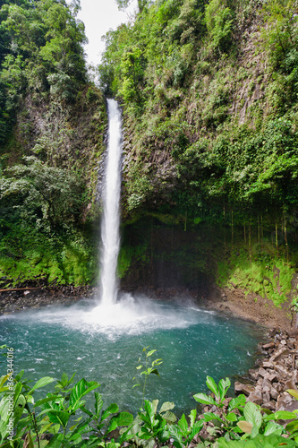 Waterfall with emerald pool in rainforest - Costa Rica