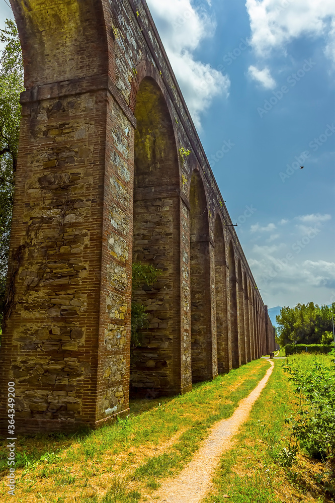 A view along the Nottolini aqueduct in Lucca Italy in summer