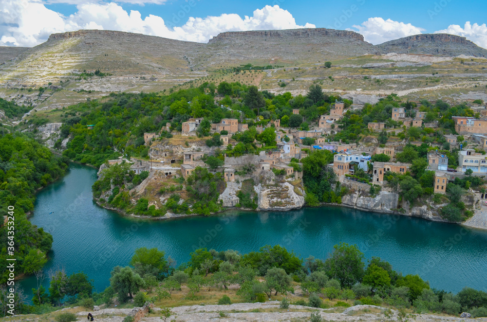 Fototapeta premium Sanliurfa, Halfeti, blue lake and green trees, hidden paradise, old houses 