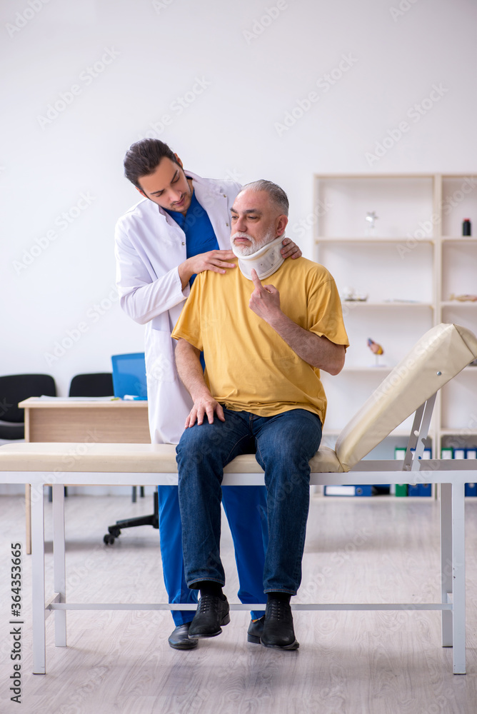 Old neck injured man visiting young male doctor