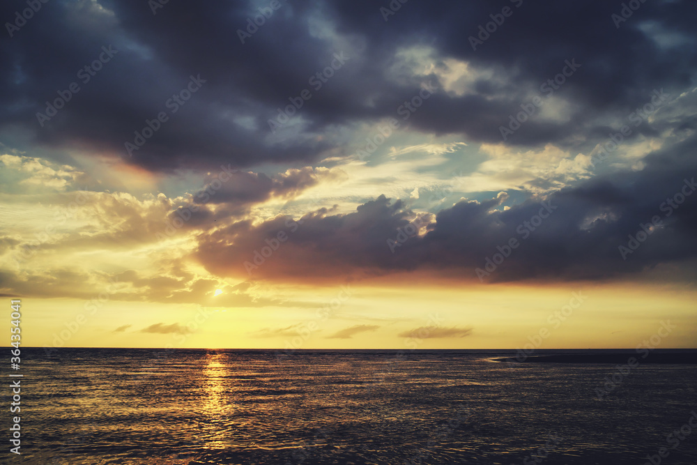 Beautiful Sunset Landscape with Clouds on the Sea.