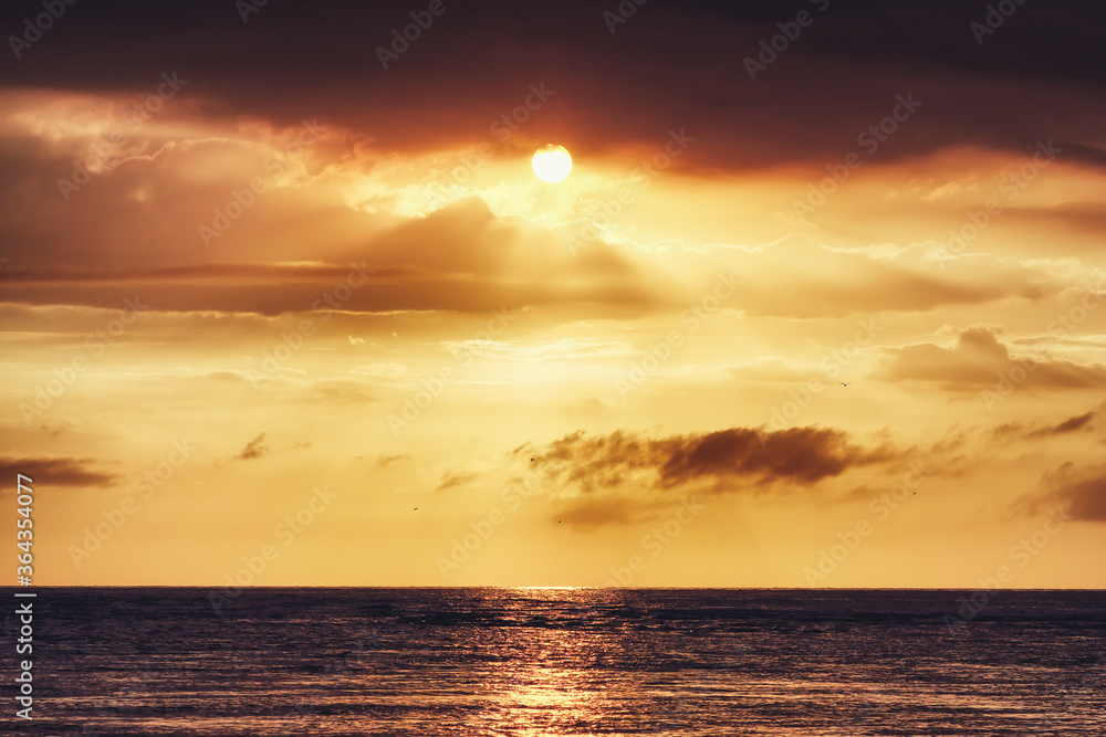 Beautiful Sunset Landscape with Clouds on the Sea.