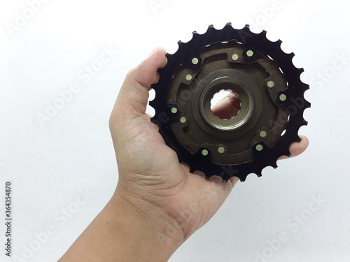 High Quality Stainless Steel Mechanical Gear Bicycle Sprocket with Seven Speed in White Isolated Background photo