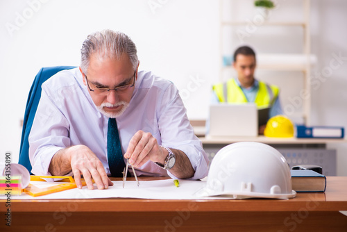 Two male architects working in the office