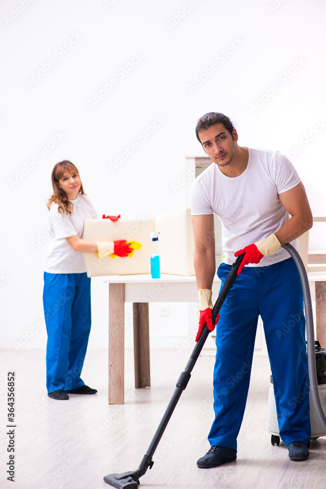 Young pair doing housework at home Young pair doing housework at home
