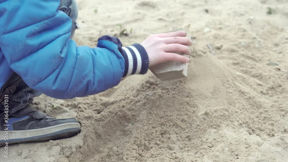 A child wearing a blue jacket playing in Estonia.4K A child wearing a blue jacket playing in Estonia.4K