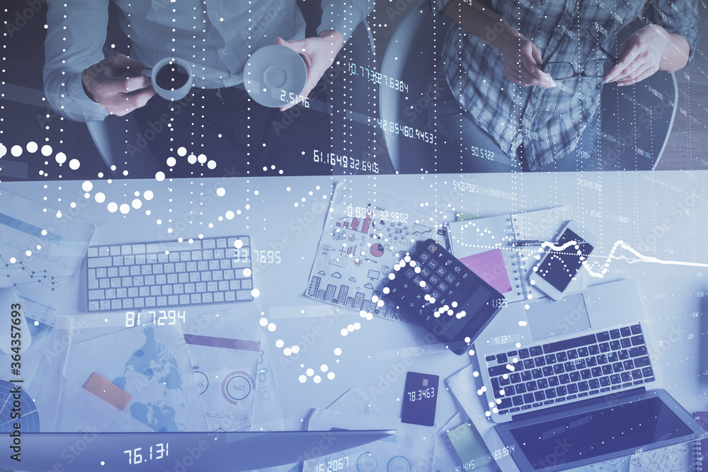 Double exposure of man and woman working together and data theme hologram drawing. Computer background. Top View. Double exposure of man and woman working together and data theme hologram drawing. Computer background. Top View.