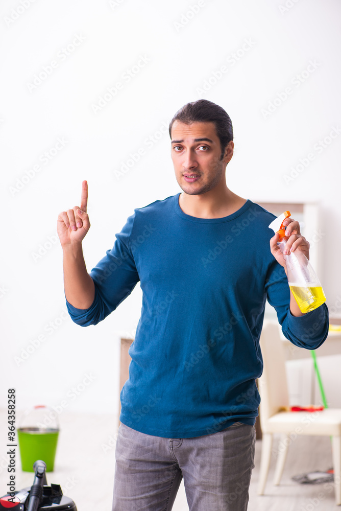 Young man husband doing housework at home Young man husband doing housework at home
