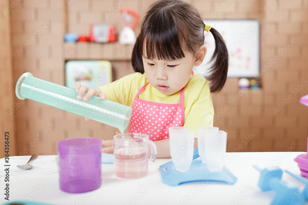 toddler girl making ice lolly for homeschooling toddler girl making ice lolly for homeschooling