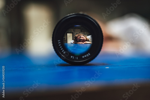 portrait of woman looking searching through lense