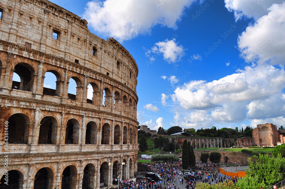 Colosseum in Rome under a beautiful blue sky