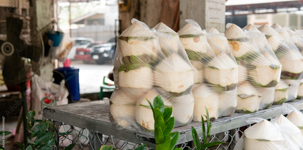 .sale of coconuts in the fruit markets of Asia. Benefits of Coconut Milk and Pulp