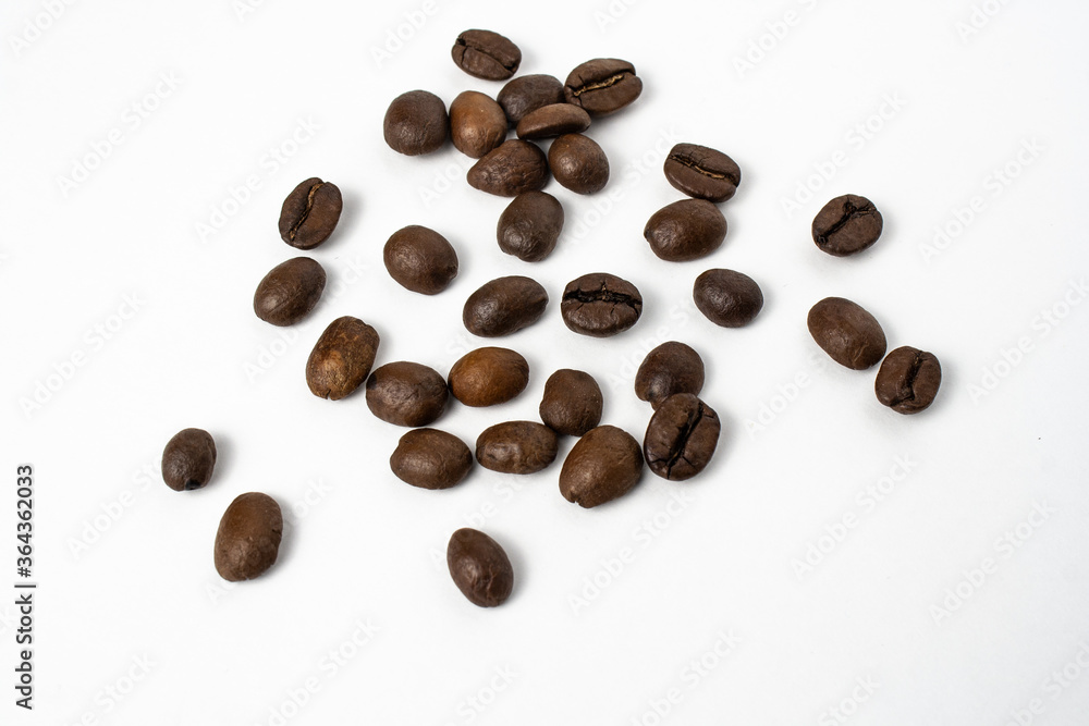 Wooden spoon with brown grains of wheat in the middle on white isolated background. Oats rye barley. Top view. Closeup. Banner for web site Wooden spoon with brown grains of wheat in the middle on white isolated background. Oats rye barley. Top view. Closeup. Banner for web site
