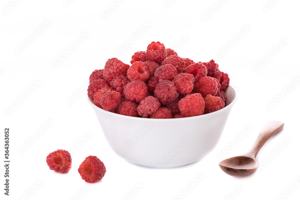Pile of fresh raspberries in a white bowl isolated on a white background. Pile of fresh raspberries in a white bowl isolated on a white background.