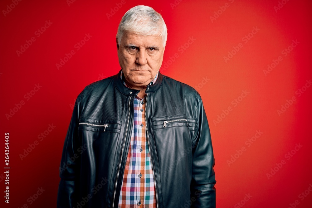 Senior handsome hoary man wearing casual shirt and jacket over isolated red background depressed and worry for distress, crying angry and afraid. Sad expression. Senior handsome hoary man wearing casual shirt and jacket over isolated red background depressed and worry for distress, crying angry and afraid. Sad expression.