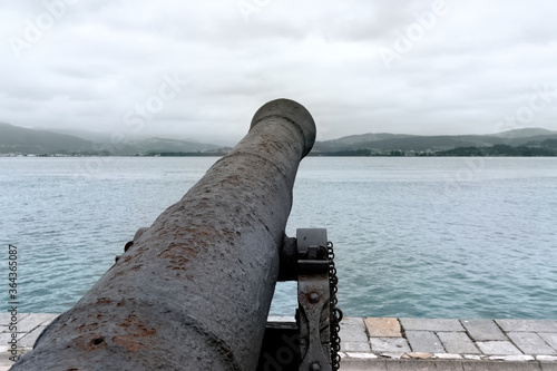 Bronze cannon pointed at the horizon. protection, defense concept