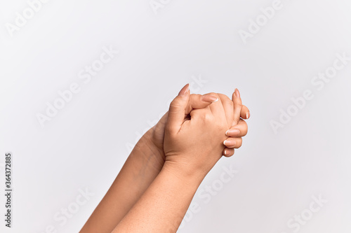 Hand of caucasian young woman with both hands crossed together showing strength and confidence