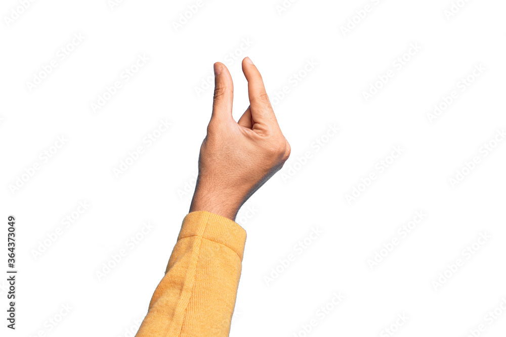 Hand of caucasian young man showing fingers over isolated white background picking and taking invisible thing, holding object with fingers showing space Hand of caucasian young man showing fingers over isolated white background picking and taking invisible thing, holding object with fingers showing space