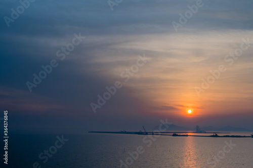Construction barges at sunset. © aminkorea