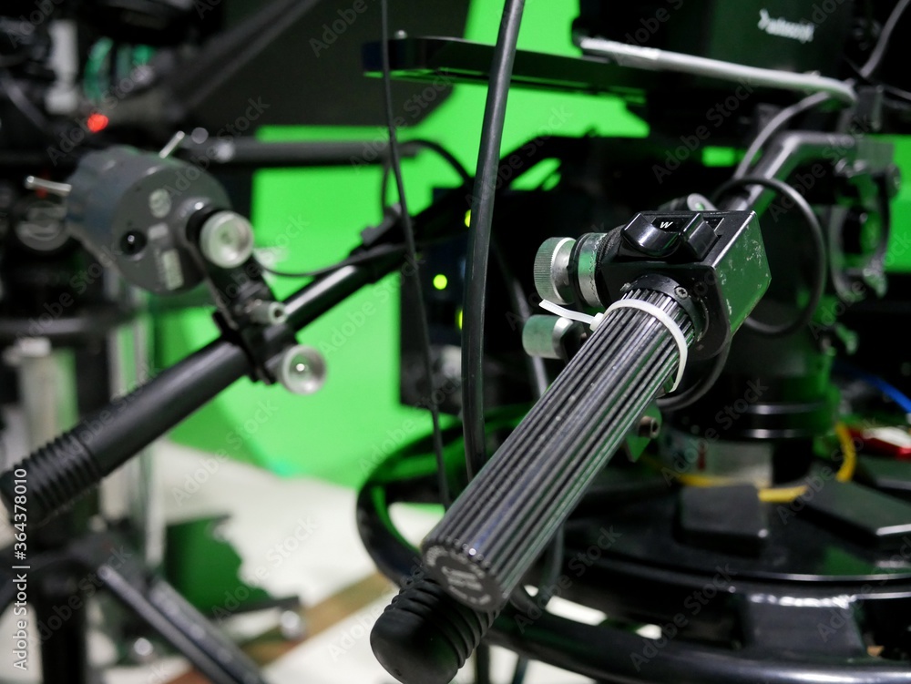 handle of professional studio camera with virtual greenscreen at TV station. handle of professional studio camera with virtual greenscreen at TV station.