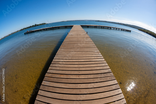 Wooden pier on the Paranoa lake. Brasilia, DF, Brazil on June 13, 2016. photo