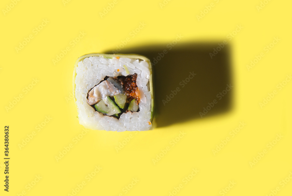 Japanese roll on yellow background. Japanese roll on yellow background.