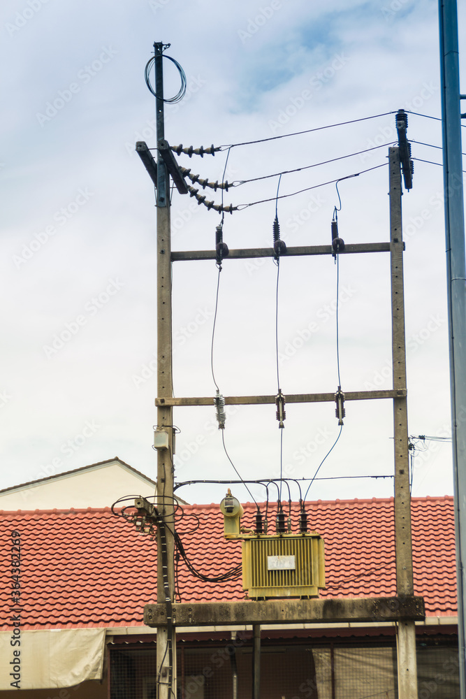 High voltage transformer on the electric poles with electrical ...