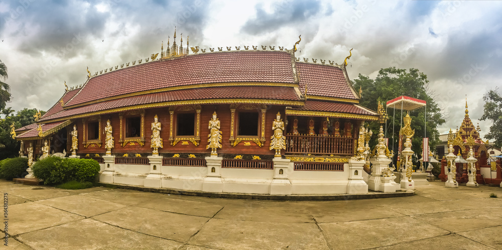 Fototapeta premium Beautiful art, religious places and religious objects in Myanmar mixed with Lanna style at Wat Ming Muang Buddhist temple, Chiang Rai, Thailand. Mixed Lanna and Burmese arts.