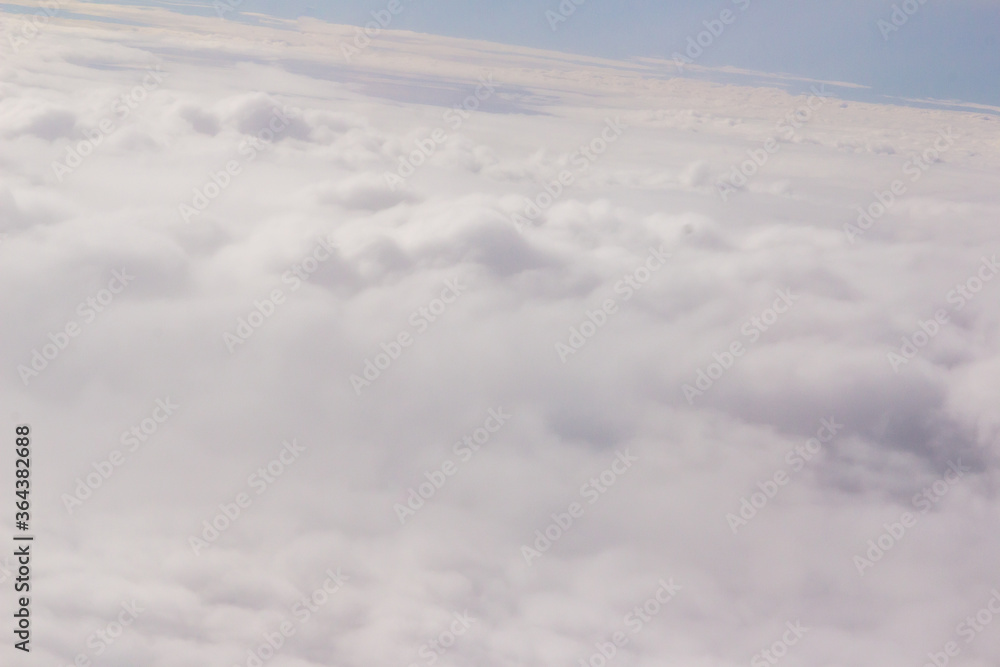 Beautiful cloudscape and blue sky from aerial view, nature view from above the sky and clouds. White clouds and blue sky view like the heaven from airplane window. Sunlight in the sky shines on clouds Beautiful cloudscape and blue sky from aerial view, nature view from above the sky and clouds. White clouds and blue sky view like the heaven from airplane window. Sunlight in the sky shines on clouds