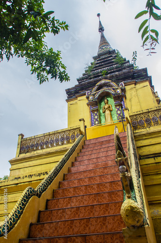 Beautiful golden Buddhist pagoda at Wat Phra That Doi Prabat (Wat Doi Phra Baht). Doi Phrabat Temple is the location of important historical sites and ancient religious in Chiang Rai, Thailand. photo