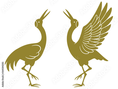 向かい合って立つ鶴のペアのシルエットイラスト（金色）