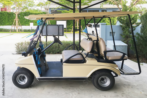 Golf cart electrical car in parking garage office waiting for transportation service on tropical warm holiday season. © ekapolsira