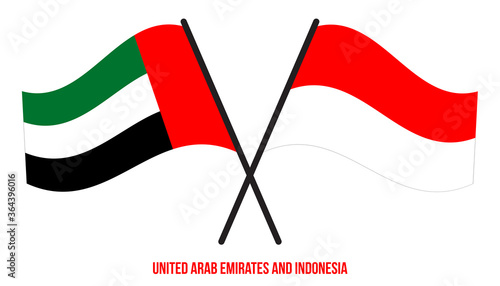 United Arab Emirates and Indonesia Flags Crossed And Waving Flat Style. Official Proportion.