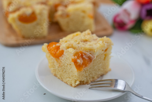 home made german apricot streusel cake on a table