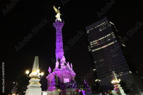 Night view of  the Angel of Independence and Skyscraper at Paseo de la Reforma (Promenade of the Reform) Mexico city, Mexico photo