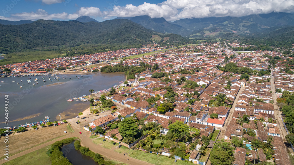 Aerial view to historic town Paraty and harbour, green mountains in background, sunny day, Unesco World Heritage, Brazil
