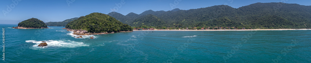Aerial view panorama of wonderful Green Coast shoreline with islands, bays and mountains covered with Atlantic Forest, Picinguaba, Brazil
