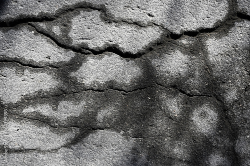 asphalt in cracks texture / abstract background cracks on asphalt road