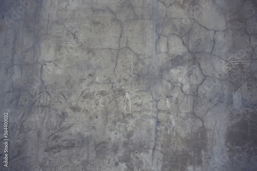 old gray wall   abstract vintage gray background  texture old concrete  plaster crack