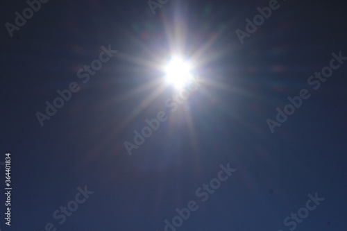 The bright sun in the sky. Abstract . Russia.