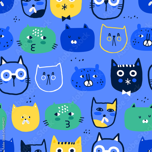 Vector seamless pattern with funny cats. Creative childish texture for fabric, wrapping, textile, wallpaper, apparel. Blue background.