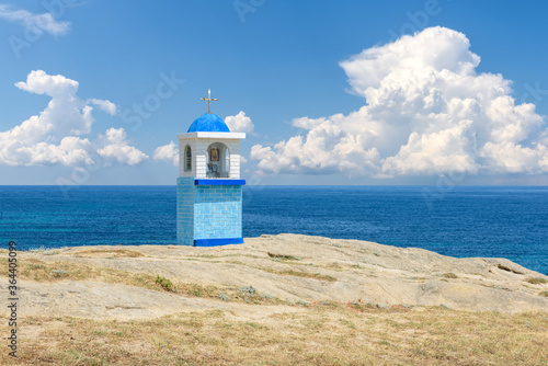 Traditional Greek small church or chapel on sea backround