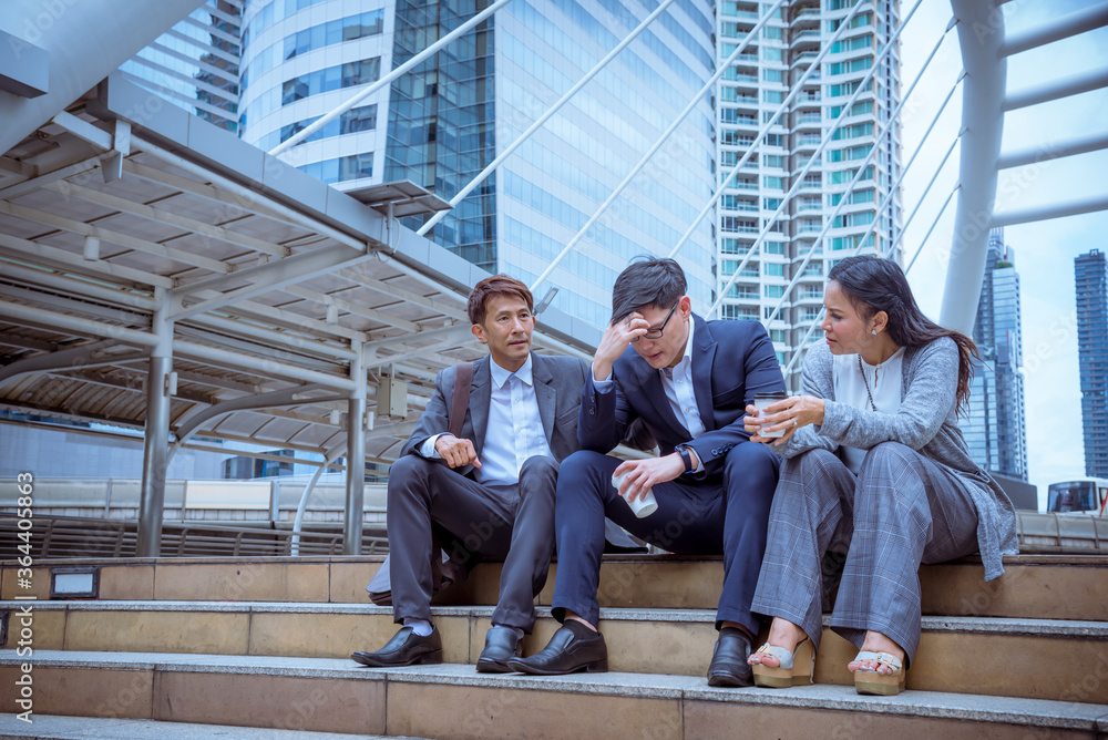 A unemployed businessman stress sitting on stair, because of economic downturn due to corona virus spread all over the world, A unemployed businessman stress sitting on stair, because of economic downturn due to corona virus spread all over the world,
