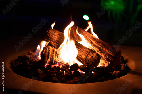 Warm and cozy evening at the gas fire pit table