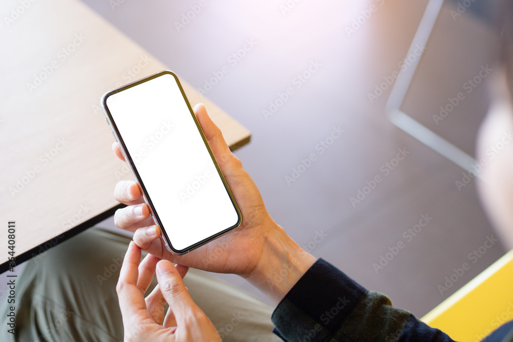 cell phone mockup image blank white screen.woman hand holding texting using mobile on desk at coffee shop.background empty space for advertise.work people contact marketing business,technology cell phone mockup image blank white screen.woman hand holding texting using mobile on desk at coffee shop.background empty space for advertise.work people contact marketing business,technology