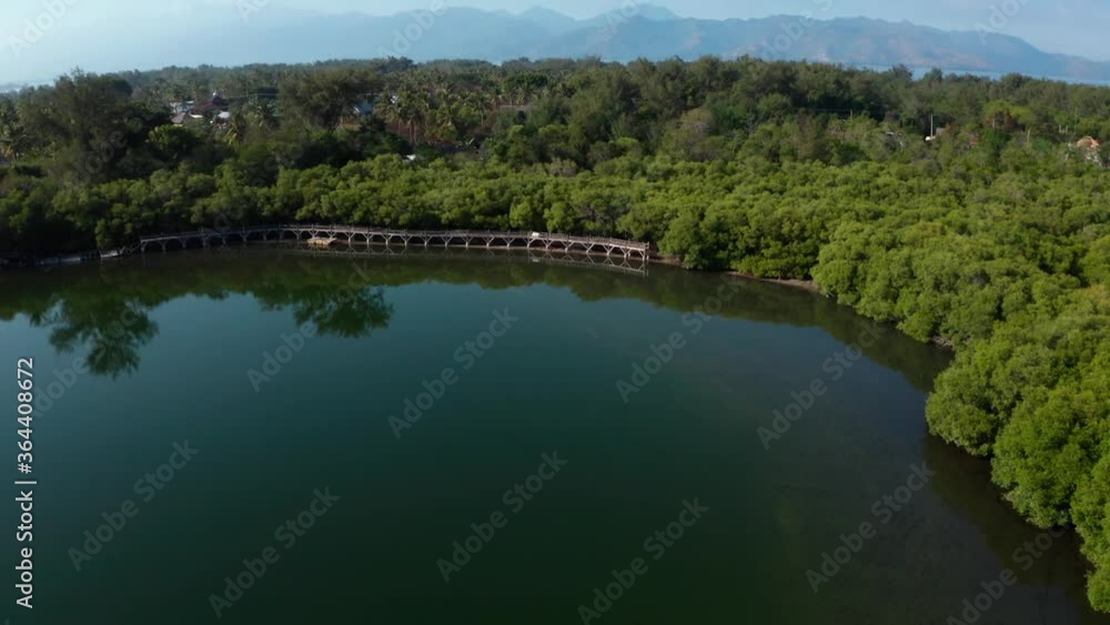The shot of a lake in Gili Meno. Beautiful scenery and landscape. Blue waters and green forest. The shot of a lake in Gili Meno. Beautiful scenery and landscape. Blue waters and green forest.