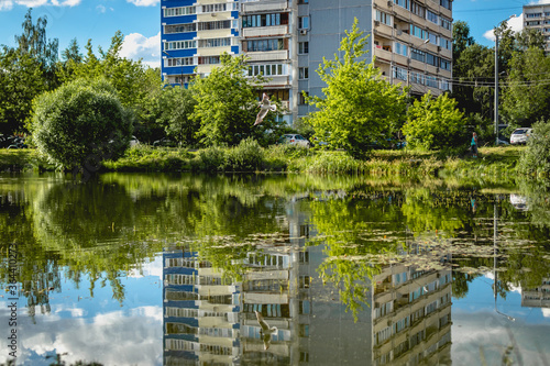 Reflection of building in the pond.