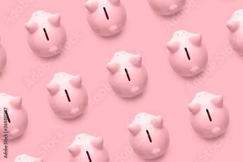 Fotografie Many piggy banks on color background
