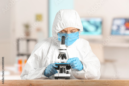 Scientist working with micr...