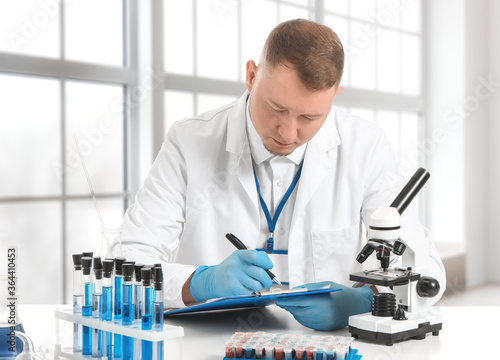 Scientist working with micr...